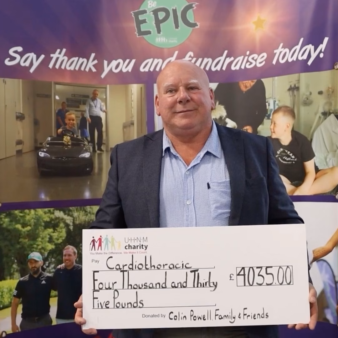 Colin holding a large cheque for £4,035