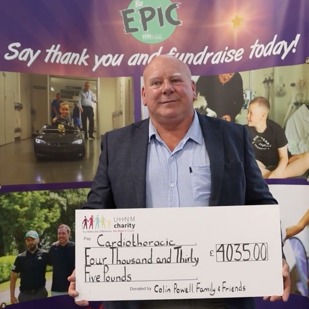 Colin holding a large cheque for £4,035